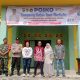Bhabinkamtibmas Polsek Sipirok, Aiptu Mulianto Siregar, bersama Babinsa dan perangkat Desa saat memasang spanduk anti narkoba di Posko Kampung bebas narkoba di Simaninggir