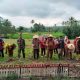 Bhabinkamtibmas Polsek Sipirok, Aiptu Anwar Sadat Harahap, bersama unsur Forkopimcam Angkola Timur, saat menggelar aksi penanaman jagung serentak di lahan seluas 0,5 Hektare