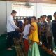 Ketua SMSI Kota Padangsidimpuan, Khairul Arief, saat menyantuni puluhan anak yatim piatu dalam rangka menyambut HPN 2025