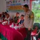 Bhabinkamtibmas Polsek Sipirok, Aiptu Anwar Sadat Harahap, saat memberikan pesan Kamtibmas di sela musyawarah khusus terkait program Ketapang dan pembentukan Koperasi Merah Putih