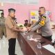 Bhabinkamtibmas Polsek Padang Bolak, Bripka Amranuddin Siregar, hadir di tengah-tengah masyarakat mengawal penyaluran BLT dari pemerintah tahun 2025