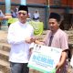 Bupati Tapsel, Gus Irawan Pasaribu, menyerahkan JKM BPJS Ketenagakerjaan ke penerima manfaat saat menghadiri peringatan Maulid Nabi Muhammad SAW yang dirangkai dengan pengajian Pemerintah Kecamatan dan BKMT Angkola Timur